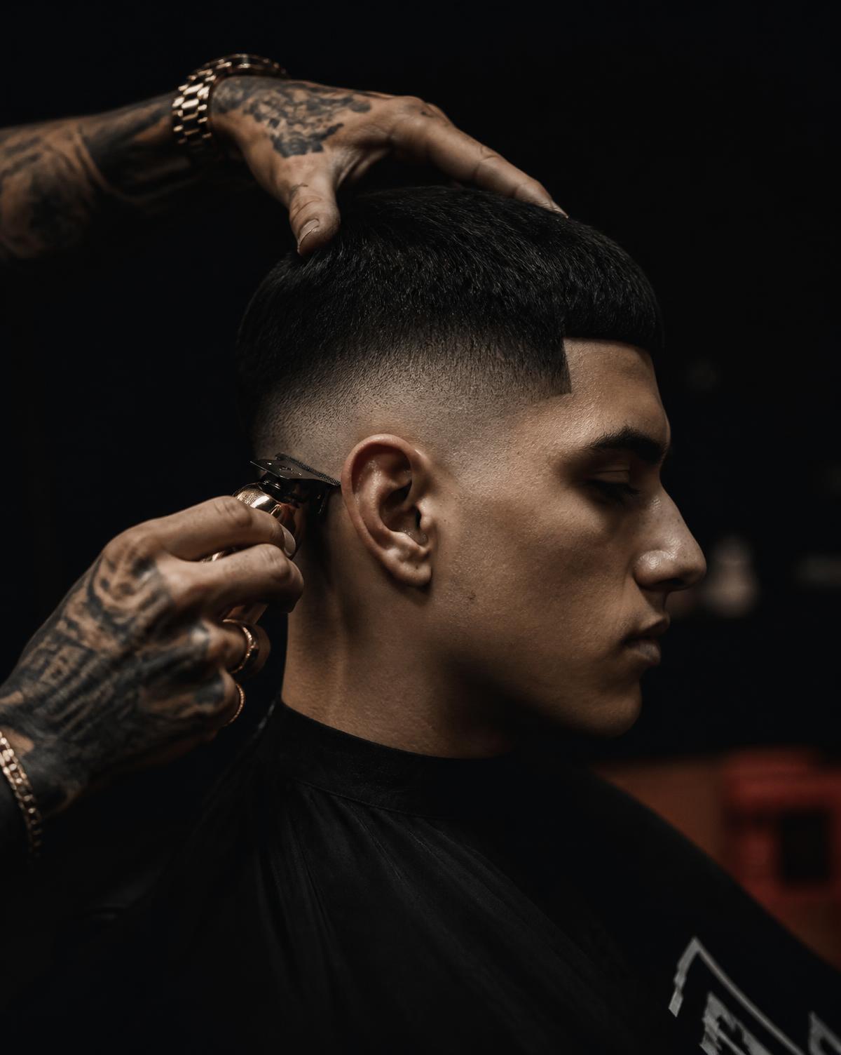 Barber finishing a razor-sharp fade at Bored Barbers in Oshawa